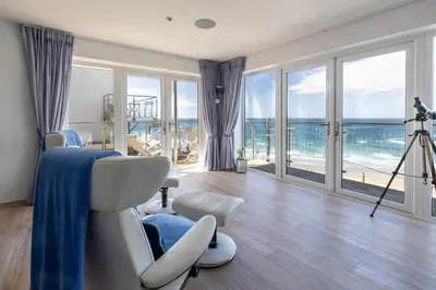 a room with a salon with a view of the ocean at The Lookout in Portreath