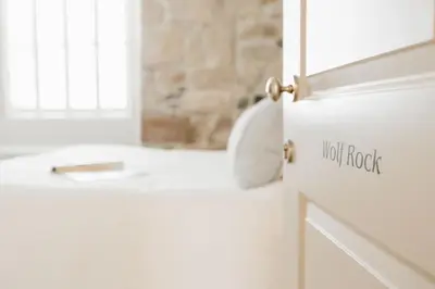 a white refrigerator with ajit rock written on the door at The Tide House in St Ives