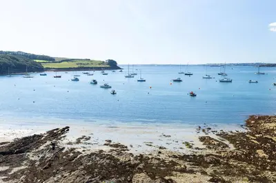 a group of boats in a large body of water at The Old Courthouse in Saint Mawes