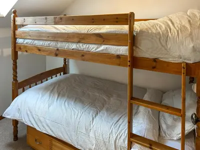 a couple of bunk beds in a room at 4 Porth Cottages in Saint Columb Minor