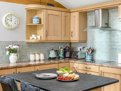 a kitchen with a plate of food on a counter at The Old Smithy in Bude