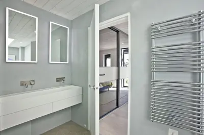 a bathroom with a sink and a mirror at Watergate Horizon in Porth