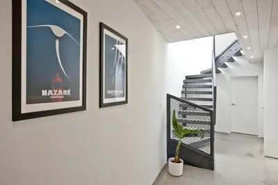 a hallway with three framed pictures on the wall at Watergate Horizon in Porth