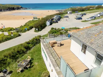 an aerial view of a house and the beach at Trewalder in St Merryn