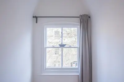 a window with a vase on top of it at The Attic, Tre-Pol-Pen in St Ives