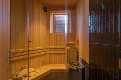 a bathroom with a shower with a glass door at Premium 3BR Cottage Sauna EV Newquay in Newquay