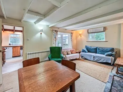a living room with a table and a couch at 3 Bed in St. Merryn oc-l34453 in St Merryn