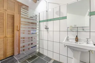 a bathroom with a sink and a glass shower at 1 Bed in St. Austell oc-b33396 in St Austell