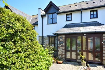 an extension to a house with glass doors at 2 Bed in Padstow oc-p00337 in Padstow