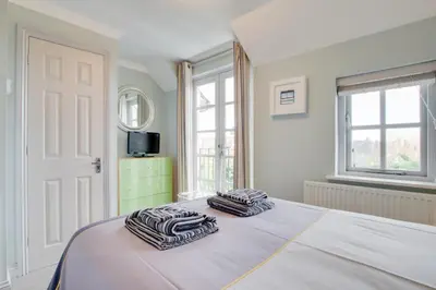 a bedroom with a bed with two towels on it at 2 Bed in Padstow oc-p00337 in Padstow