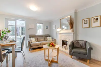 a living room with a couch and a fireplace at 2 Bed in Padstow oc-p00337 in Padstow