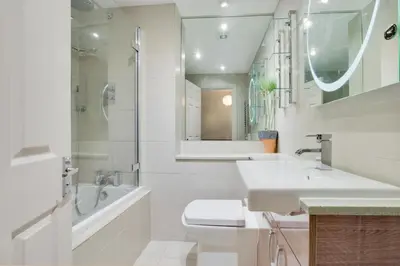 a white bathroom with a toilet and a sink at 2 Bed in Padstow oc-p00337 in Padstow