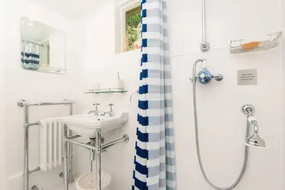 a bathroom with a sink and a shower at Ladye Park in Liskeard
