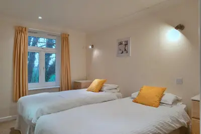 a bedroom with two beds and a window at Finest Retreats - 20 Chy Lowen in Newquay