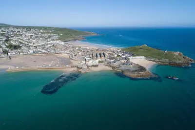 an aerial view of a small island in the ocean at Happy Days Cottage - Free WiFi - Minutes from Harbour & Beaches - Pets Welcome in St Ives