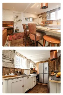 a kitchen with white cabinets and a counter top at Relaxing historic Roncon's Villa, The Paddock in Perranuthnoe