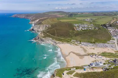 an aerial view of a beach and the ocean at 3 Bed in Porthtowan oc-e34620 in Porthtowan