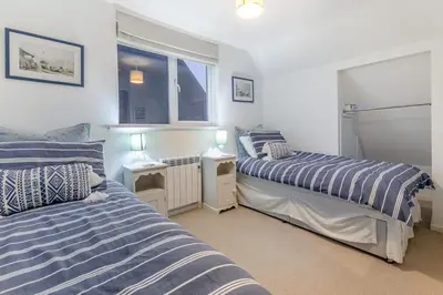 a bedroom with two beds and a window at 2 Bed in Mylor Bridge oc-p34490 in Mylor Bridge