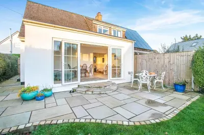 a patio with a table and chairs in a yard at 2 Bed in Mylor Bridge oc-p34490 in Mylor Bridge