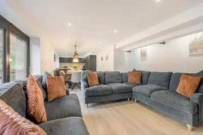 a living room with two couches and a table at 4 Bed in St. Gennys oc-p34626 in Crackington Haven