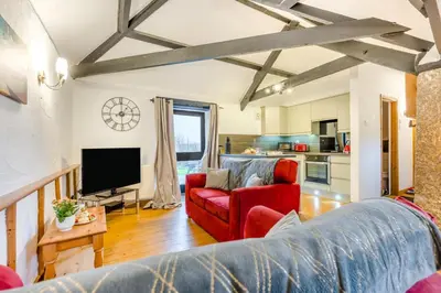 a living room with a couch and a tv at 2 Bed in St. Gennys oc-o34630 in Crackington Haven