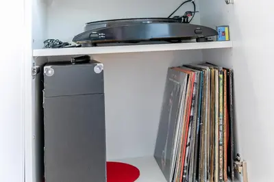 a shelf with a record player and dvds at 2 Bed in St. Ives oc-t34467 in St Ives