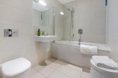 a white bathroom with a toilet and a sink at 2 Bed in St. Ives oc-t34467 in St Ives