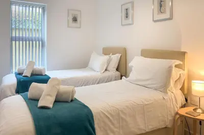 a bedroom with two beds with towels on them at 2 Bed in St. Ives oc-t34467 in St Ives