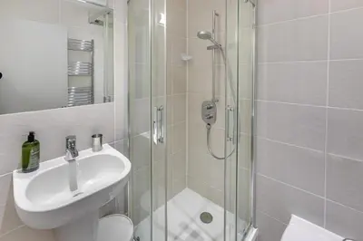 a bathroom with a shower and a sink and a toilet at 2 Bed in St. Ives oc-t34467 in St Ives