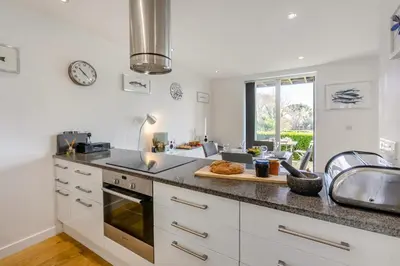 a kitchen with white cabinets and a counter top at 2 Bed in St. Ives oc-t34467 in St Ives