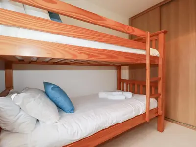 a bunk bed room with two bunk beds at Blissful Ocean Breeze in Perranporth