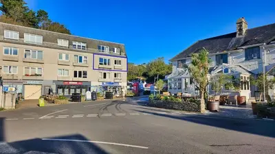 an empty street in a small town with buildings at Little Egret in Saint Mawes