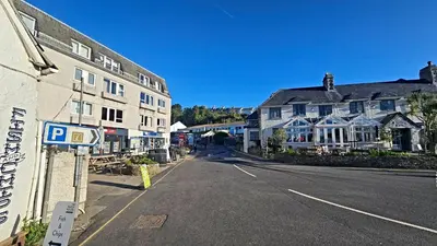 an empty street in a small town with buildings at Little Egret in Saint Mawes