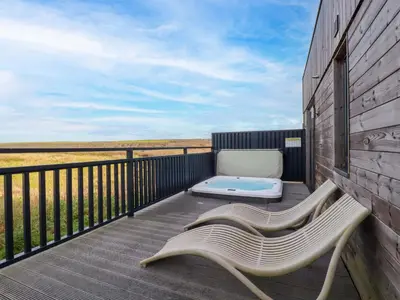 a balcony with a chaise lounge and a mattress at South Crofty - The Residence in Redruth