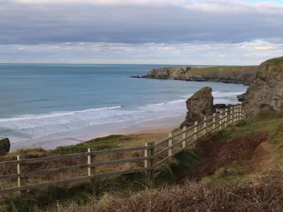 a view of the beach from the cliffs at The Granary, Engollan in Wadebridge