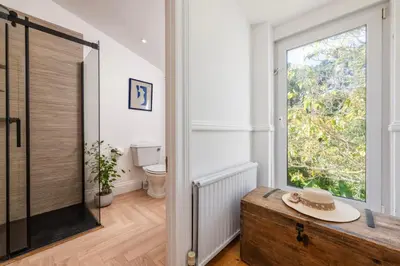 a bathroom with a toilet and a window at Beautiful Perranporth country house near the beach in Perranzabuloe