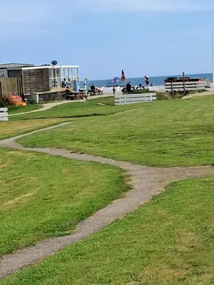 a path in the grass near the beach at Ocean Blue in Saint Martin