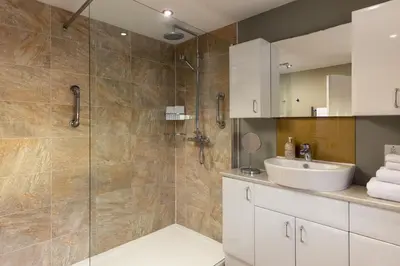 a bathroom with a sink and a shower at Easy Oars - Flushing, Falmouth in Flushing