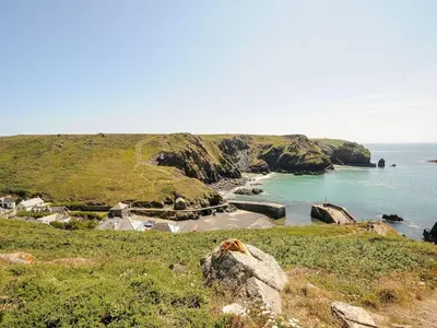 a view of a beach with the ocean at Little Tregarrick in Helston