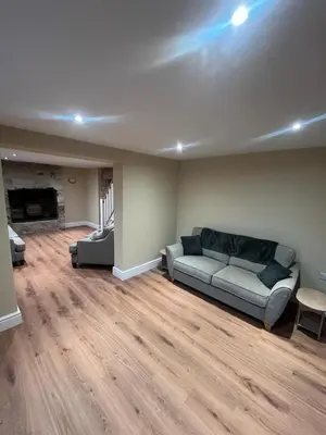 a living room with a couch and a fireplace at Cosy Cottage Hot Tub Sleeps 8 Log Fires in Carnbrea
