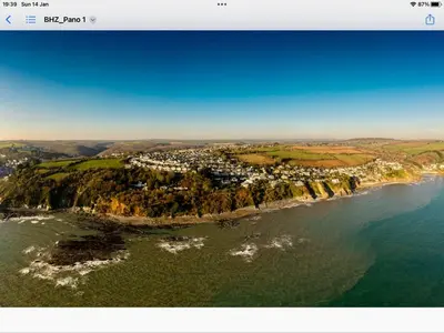 an aerial view of a small island in the ocean at Looe sea view sleeps 2 free parking in Looe