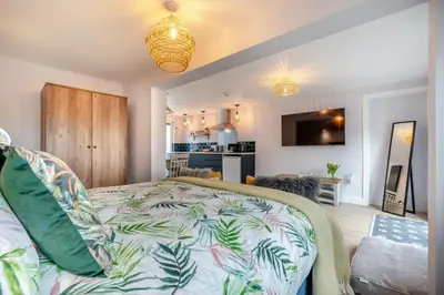 a bedroom with a bed and a living room at 1 Bed in Newquay oc-l28083 in Newquay
