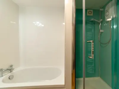 a bathroom with a shower and a sink and a shower at Holiday Home Zion by Interhome in Gorran Haven