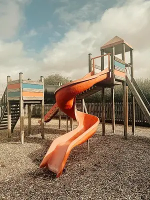 a playground with a slide on at Tredethick Farm Cottages in Lostwithiel
