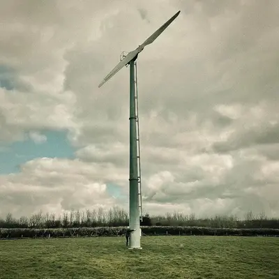 a wind turbine in the middle of a field at Tredethick Farm Cottages in Lostwithiel