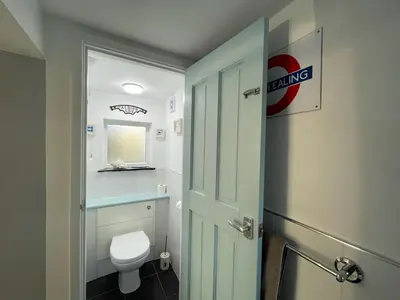 a bathroom with a white toilet and a sink at Sandown 4 bedroom house St Teath in Saint Teath