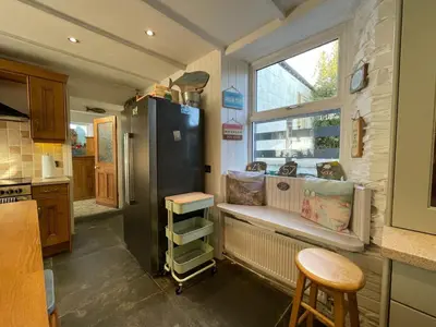 a kitchen with a black refrigerator and a window at Sandown 4 bedroom house St Teath in Saint Teath