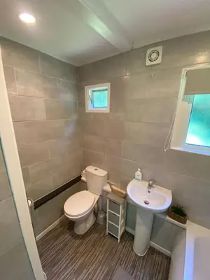 a bathroom with a toilet and a sink at Villa 49 Lanteglos Hotel 2 bedroom sleeps 4 in Lanteglos