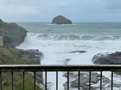 a view of the ocean from a balcony at Praxis Trebarwith Strand in Treknow