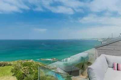 a view of the ocean from the balcony of a house at Beachfront Townhouse Lovely Sea Views Newquay in Newquay